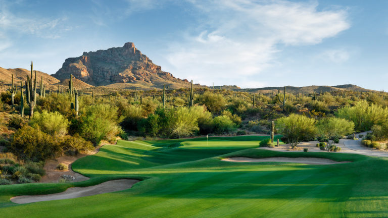 A beautiful, desert golf course at sunset.